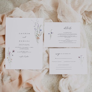 May include: Wedding invitation suite with a floral design. The invitation card features the names "Lauren and Daniel" and the wedding date "Saturday, October 7, 2023". The details card includes information about the wedding venue, website, and accommodation. The RSVP card has a floral design and a space for guests to RSVP by October 1st.