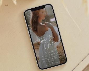 May include: A smartphone displaying a digital invitation for a 21st birthday party. The invitation features a photo of a woman in a white dress with the text "Twenty One" in a cursive font. The invitation includes the birthday person's name, date, time, and location.