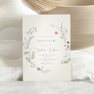 May include: A white card with a floral wreath border and a gold cross. The text reads "Please join us for the Baptism of our daughter Sabrina Wilson Saturday, June 21 at 5:00 PM St. Anastoly Church 316 White Lilac San Diego, CA 92184 RSVP 123-456-6789".