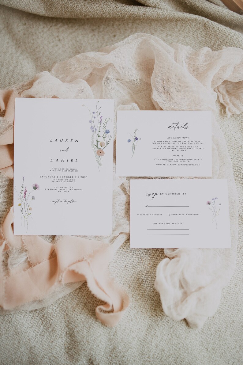 May include: Wedding invitation suite with a floral design. The invitation card features the names "Lauren and Daniel" and the wedding date "Saturday, October 7, 2023". The details card includes information about the wedding venue, website, and accommodation. The RSVP card has a floral design and a space for guests to RSVP by October 1st.