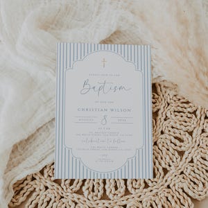blue christening invite with clean typography and soft tones