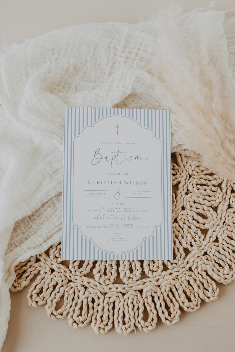 blue christening invite with clean typography and soft tones