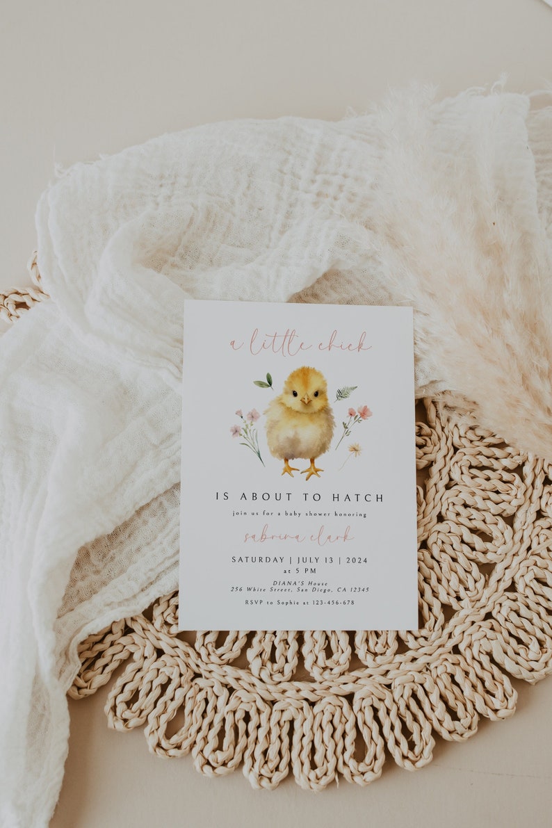 May include: A baby shower invitation with a cute illustration of a yellow chick with pink flowers. The text reads "a little chick is about to hatch" and includes the name "Sabrina Clark" and the date "Saturday, July 13, 2024".