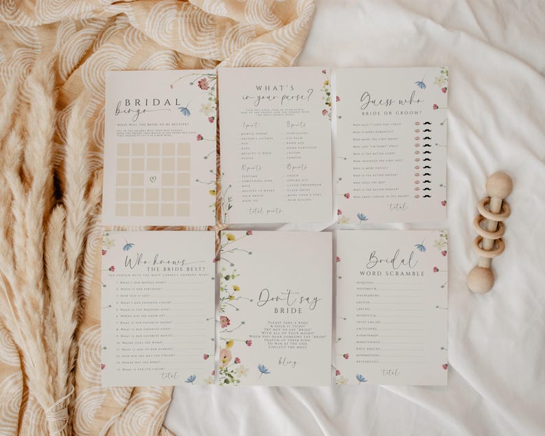 May include: A set of six printable bridal shower game cards with floral designs. The games include "Bridal Bingo", "What's in your purse?", "Guess who - Bride or Groom", "Who knows the bride best?", "Don't say bride", and "Bridal Word Scramble".