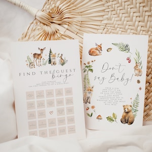 May include: Two printable baby shower games. One game is "Find the Guest Bingo" with woodland animal illustrations. The other game is "Don't Say Baby!" with a bear and bunny illustration. Both games have text on a white background.