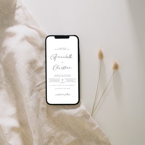 May include: A wedding invitation on a smartphone screen. The invitation is for a wedding ceremony on Saturday, August 7, 2024, for Annabelle and Christian. The invitation states that the ceremony will be held at 3 o'clock in the afternoon at Torrey Pines in San Diego, California.