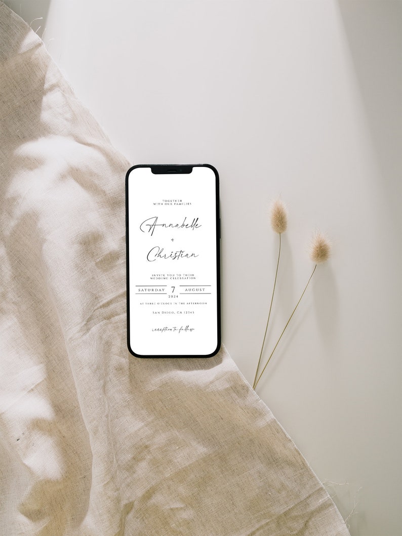 May include: A wedding invitation on a smartphone screen. The invitation is for a wedding ceremony on Saturday, August 7, 2024, for Annabelle and Christian. The invitation states that the ceremony will be held at 3 o'clock in the afternoon at Torrey Pines in San Diego, California.