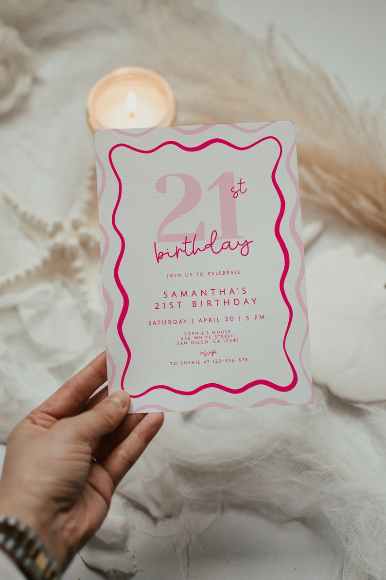May include: Pink and white invitation card with a wavy border. The card says "21st birthday" and includes details for Samantha's 21st birthday party. The party is on Saturday, April 20th at 5 PM at Sophie's House, 256 White Street, San Diego, CA 12345. RSVP to Sophie at 123-456-678.