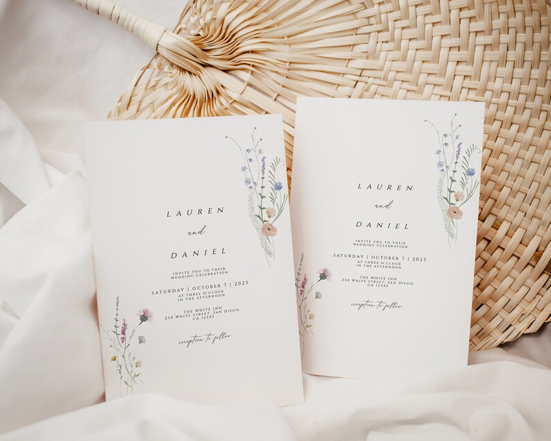 May include: Wedding invitation with a floral design. The invitation reads "Lauren and Daniel" and includes the date and time of the wedding. The invitation also includes the location of the wedding, "The White Inn, 278 White Street, San Diego, CA 92172".