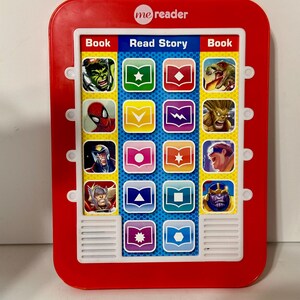 May include: A red "me reader" electronic book with a white speaker and buttons. The screen displays Marvel characters and the words "Book" and "Read Story".