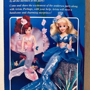 May include: A vintage box featuring two mermaid dolls from Disney's The Little Mermaid. One doll has red hair and a pink outfit, the other has blonde hair and a blue outfit. The box has the text "Ariel's Sister Arista".