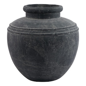 May include: A large, round, black ceramic vase with a textured surface. The vase has a wide mouth and a narrow base.