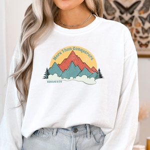 Romans Bible verse sweatshirt Comfort Colors More than conquerors shirt Christian crewneck mountains Faith shirt women Christian t-shirt men