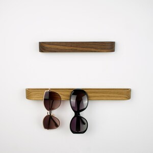 Minimalist wooden glasses holder made of natural oak wood, self adhesive wall hook for reading glasses, modern eyewear organizer for office, bathroom or hallway, Scandinavian design accessory