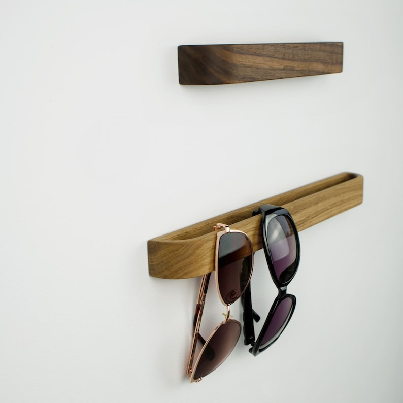 Minimalist wooden eyewear holder crafted from American walnut, self adhesive wall hook for reading glasses, functional and stylish organizer for contemporary interiors
