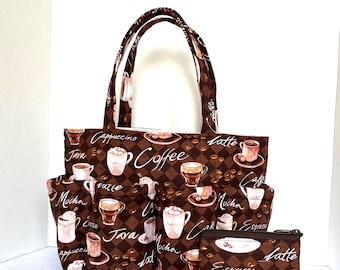 May include: A brown tote bag, a smaller bag, and a matching pouch. All items feature a repeating pattern of coffee cups, coffee beans, and coffee-related words like "Latte" and "Mocha" on a checkered background.