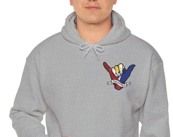 May include: A light gray hoodie with a front pocket and a drawstring hood. The hoodie features a small graphic on the chest of a hand gesture in red, yellow, and blue, with the word "Philippines" on a banner.