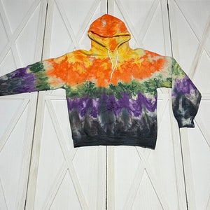 Fall inspired tie dyed adult Gildan hoodie in adult size medium. Halloween colors of yellow, orange, green, purple, and a hint of black.