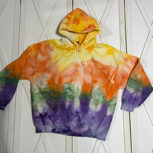 Fall inspired tie dyed adult Gildan hoodie in adult size XL. Halloween colors of yellow, orange, green, purple, and a hint of black.