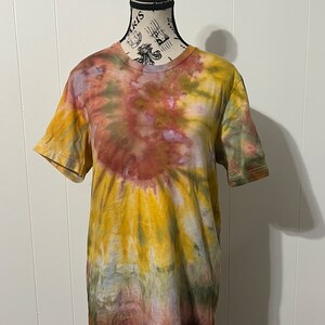 Bella Canvas adult unisex size medium tie dye tshirt in yellow, green, and burgundy resembling the colors of a sunflower.
