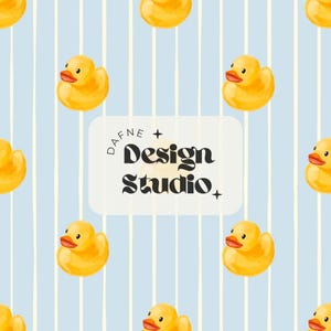May include: A repeating pattern of yellow rubber ducks with orange beaks and a light blue background with vertical white stripes. The text "DAFNE + Design Studio" is in a white rectangle.