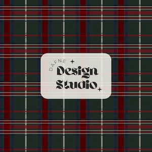 May include: A dark green, red, and navy blue plaid pattern featuring thin white intersecting lines. Centered is a light-colored rectangular label with rounded corners containing the black text Dafne Design Studio and two small four-pointed stars.