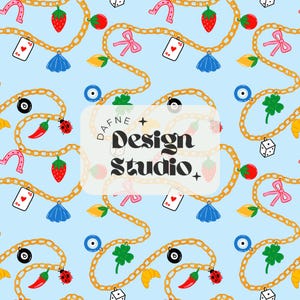 May include: A light blue seamless pattern featuring gold chains adorned with various charms including strawberries, pink bows, playing cards, dice, ladybugs, chili peppers, croissants, four-leaf clovers, and evil eyes. Text reads Dafne Design Studio.