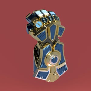 May include: A gold and blue metallic gauntlet with a detailed design. The gauntlet has a large, circular opening on the back of the hand.