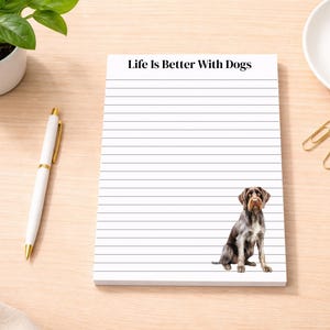 May include: A set of three ceramic mugs with a speckled, matte finish. The mugs are in shades of cream, light gray, and dark gray. Each mug has a simple, minimalist design, perfect for coffee or tea.