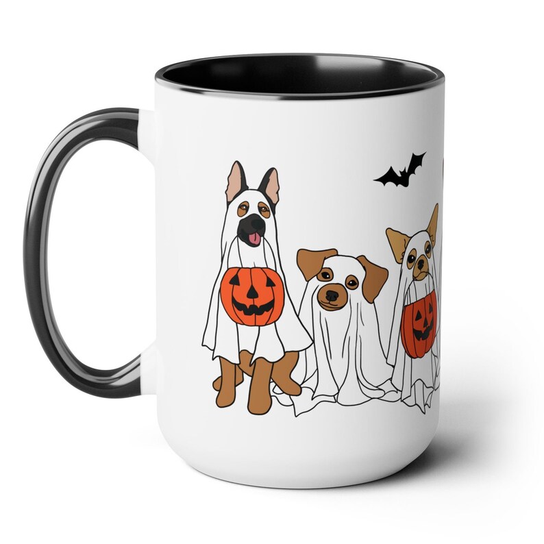 halloween ghost dog mug with a row of dogs in ghost costumes some carrying pumpkins and two black bats above them black interior and black handle 15 oz ceramic mug