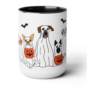 halloween ghost dog mug with a row of dogs in ghost costumes some carrying pumpkins and two black bats above them black interior and black handle 15 oz ceramic mug