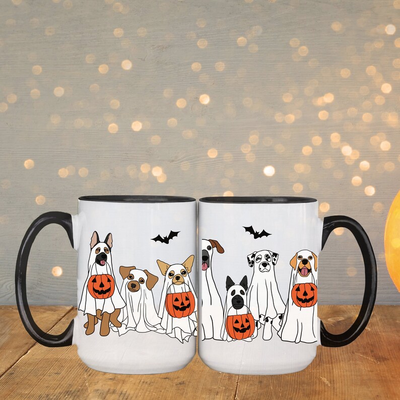 halloween ghost dog mug with a row of dogs in ghost costumes some carrying pumpkins and two black bats above them black interior and black handle 15 oz ceramic mug