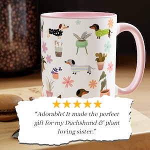 playful dachshunds in colorful bright sweaters with a large variety of plants15 oz ceramic mug with pink black or blue handles and matching interior