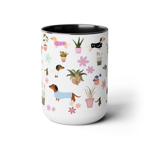 15 oz ceramic mug with colorful dachshunds and plants black interior and matching handle