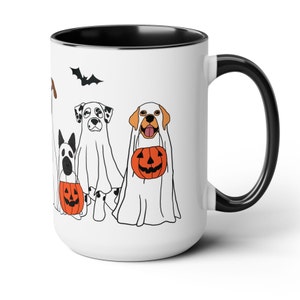 halloween ghost dog mug with a row of dogs in ghost costumes some carrying pumpkins and two black bats above them black interior and black handle 15 oz ceramic mug
