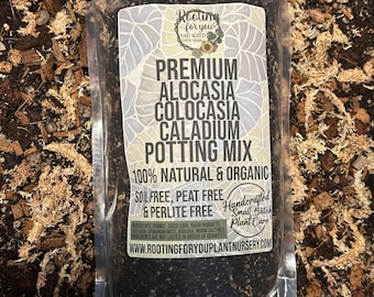May include: A clear plastic bag filled with dark brown potting mix for Alocasia, Colocasia, and Caladium plants. The bag has a white label with the text "Rooting for you Plant Nursery" and "Premium Alocasia Colocasia Caladium Potting Mix 100% Natural & Organic Soil Free, Peat Free & Perlite Free Handcrafted Small Batch Plant Care www.rootingforyouplantnursery.com".