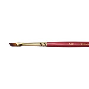 May include: A 1/8 inch angled brush with a gold ferrule and a red handle. The handle is labeled "Chris's"