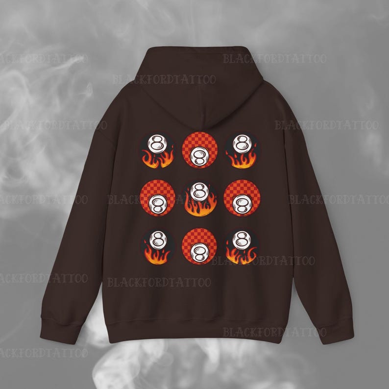 May include: A brown hoodie with a pattern of eight-ball pool balls with flames on a red and white checkered background.