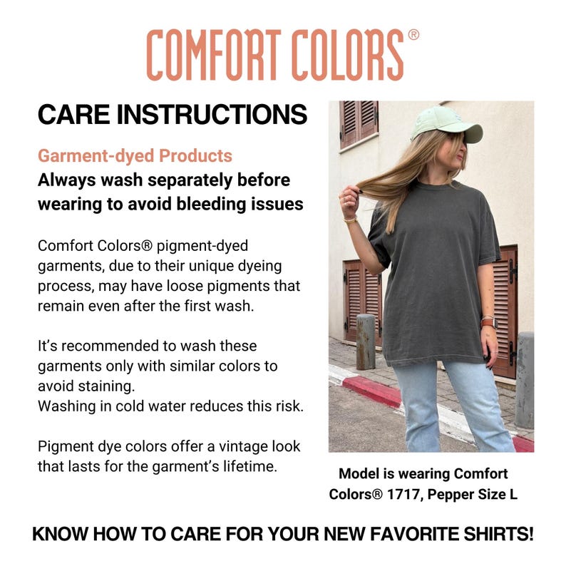 May include: A Comfort Colors t-shirt in a dark gray color, with care instructions and the Comfort Colors logo. The shirt is worn by a person wearing a light green cap and light blue jeans.