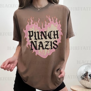 Koszulka "Punch Nazis" z napisem "Pieprzyć oligarchię, patriarchat, zjedz bogatych" Koszulka z napisem "Opór przeciwko kapitalizmowi" Najpopularniejsze koszulki z napisem "Trudno się bić"