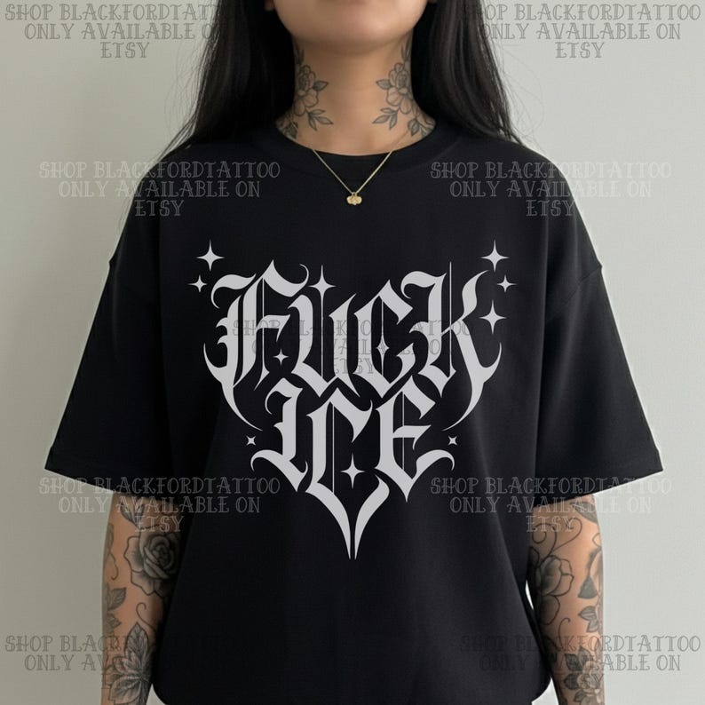 May include: Black t-shirt with a white gothic-style graphic that reads "Fuck Me" in a heart shape. The shirt has short sleeves and a relaxed fit. The text "SHOP BLACKFORDTATTOO ONLY AVAILABLE ON ETSY" is printed around the shirt.