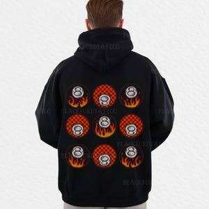 May include: Black hoodie with a design of nine red and white checkered circles with a white eight ball in each circle and flames around each ball.