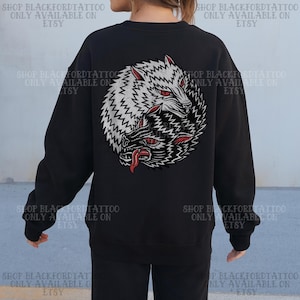May include: Black sweatshirt featuring a detailed graphic of two wolves in a yin-yang design. One wolf is white, the other black, with red eyes and tongues. The text "SHOP BLACKFORDTATTOO ONLY AVAILABLE ON ETSY" is printed around the edges.