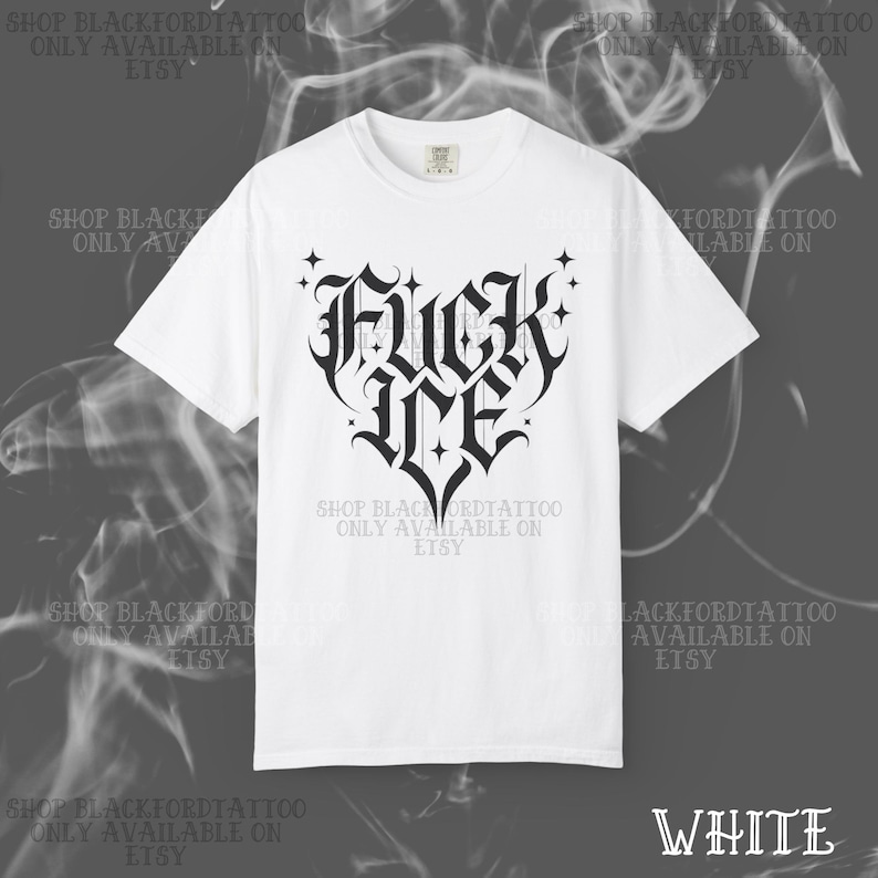 May include: White t-shirt with a black gothic-style heart-shaped graphic that reads "FUCK ME". The shirt also has text that says "SHOP BLACKFORDTATTOO ONLY AVAILABLE ON ETSY" in a repeating pattern. The word "WHITE" is in the bottom right corner.