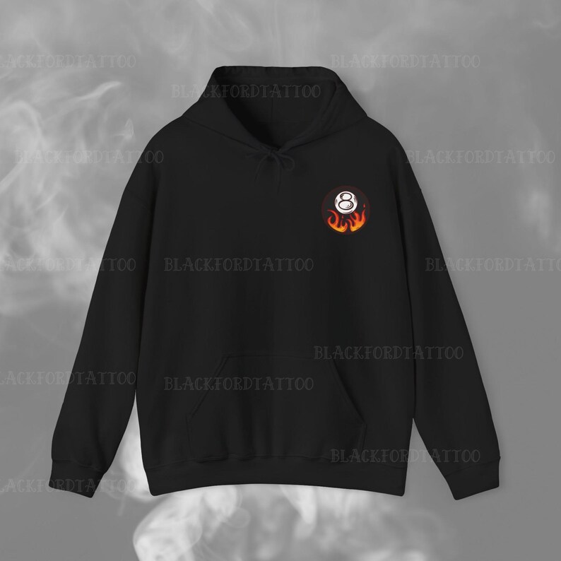 May include: Black hooded sweatshirt with a white 8-ball graphic with flames on a black background.