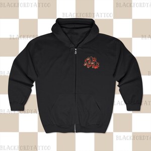 May include: Black zip-up hoodie with a graphic of three black panther heads with flames on the left chest.