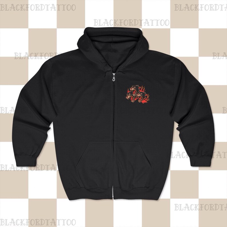May include: Black zip-up hoodie with a graphic of three black panther heads with flames on the left chest.