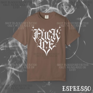 May include: Espresso-colored t-shirt with a white, stylized heart-shaped graphic that reads "FUCK ME". The shirt has short sleeves and a crew neck. The text "SHOP BLACKFORDTATTOO ONLY AVAILABLE ON ETSY" is printed around the shirt.