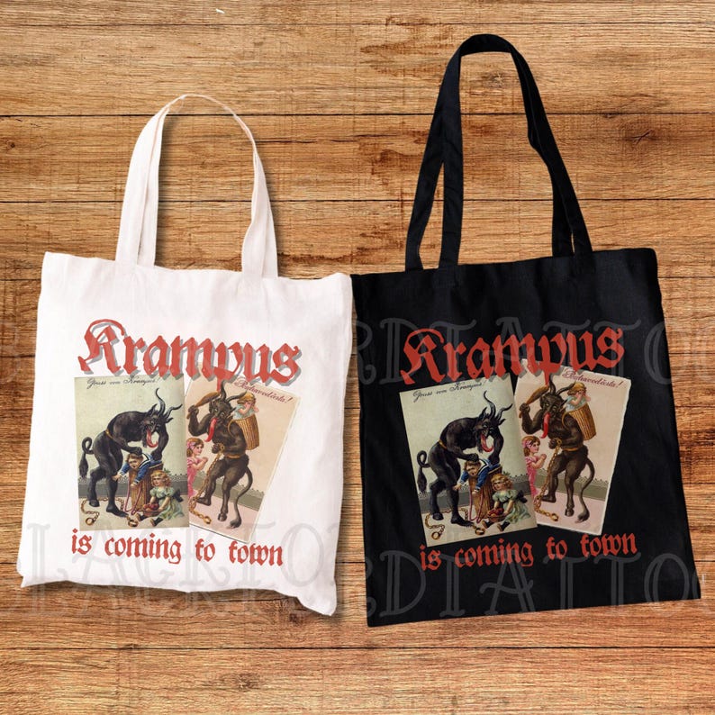 May include: Two tote bags, one white and one black, featuring a vintage illustration of Krampus, a mythical creature, on each. The text "Krampus is coming to town" is printed on both bags.