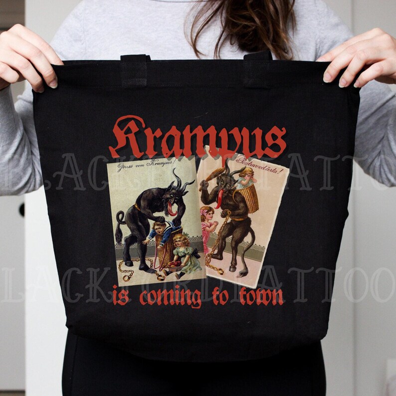 May include: Black tote bag featuring a red graphic that reads "Krampus is coming to town". The graphic includes two vintage illustrations of Krampus, a horned, goat-like creature, with children.